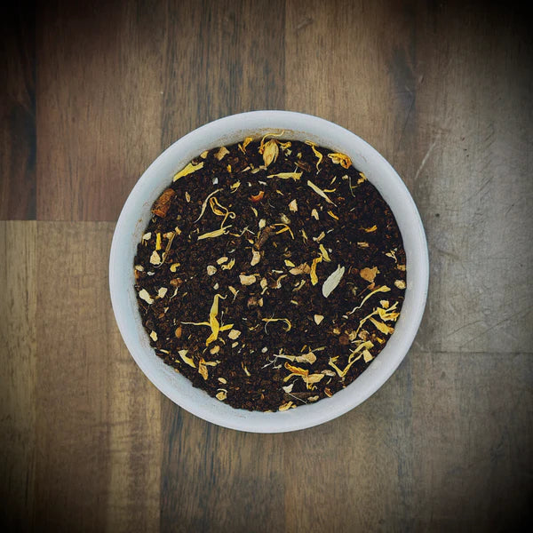 Loose leaf Masala Chai artisan tea by Little Farm Town Coffees in a 3oz package with fragrant spices and tea leaves.