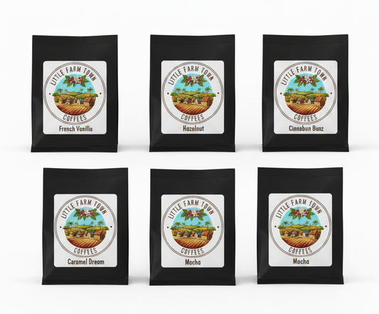 Six 2oz flavored coffee sampler bags from Little Farm Town Coffees, perfect for tasting or gifting, displayed in the image.