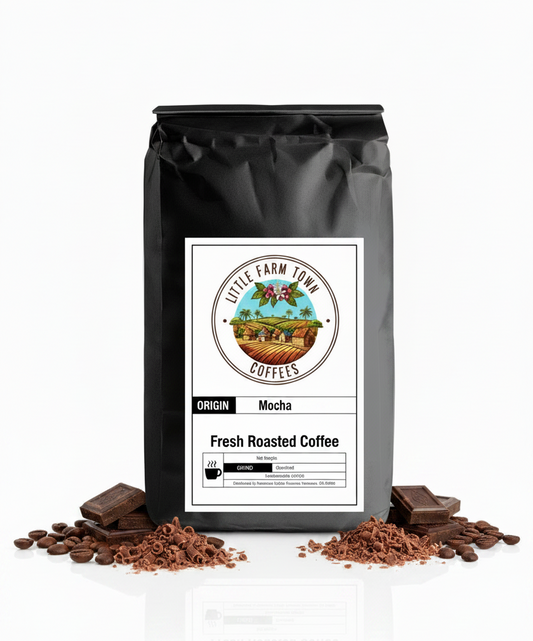Creamy mocha specialty coffee by Little Farm Town Coffees on a white background, showcasing the rich, smooth beverage.