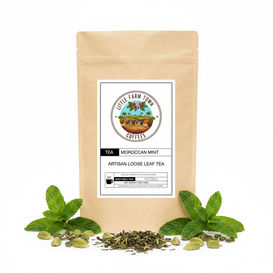 Artisan Moroccan Mint tea from Little Farm Town Coffees, featuring fresh mint leaves and brewed tea in a white cup.