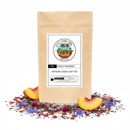 Artisan Peach Paradise tea from Little Farm Town Coffees, featuring fresh peach slices and fragrant herbal tea leaves in a white cup.